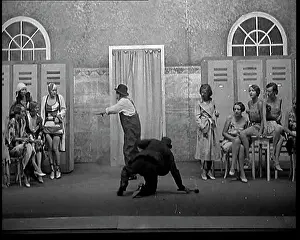 Swimsuits: Scene From a Stage Show: Two Male Actors Falling
