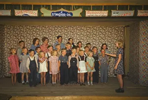 Shoeless: School children some barefoot singing on ?