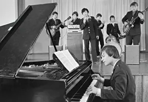 Rehearses: School instrumental ensemble