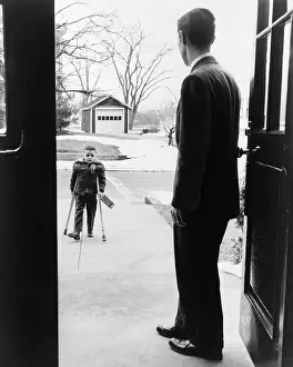 Cripples: School principal, E. Joseph LaLiberte, waits ?