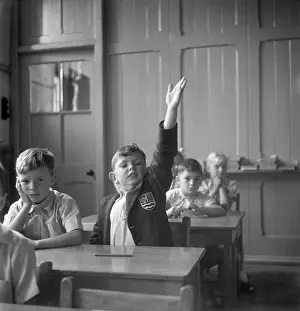 Henry Grant Collection: Schoolboy raises his hand