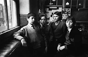 Variations: Four schoolboys in a classroom