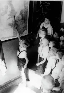 Schoolboys: Schoolboys in history lessons based on a Wehrmacht report