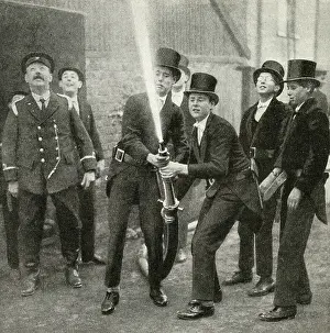 Practising: Schoolboys practising hose drill, Eton School, Berkshire