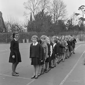 Behaved: Schoolchildren line up in playground