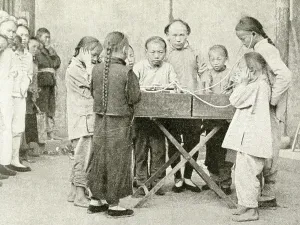 Plaited: Schoolchildren listening to recording, China, East Asia