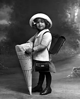 Enrolment: Schoolgirl with sweets 1910
