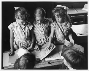 Intently: THREE SCHOOLGIRLS