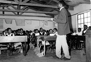 Schoolteacher: Schoolteacher and class in rural school at Braaklaagte
