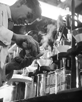 Beaker: SCIENTIST POURS 1955