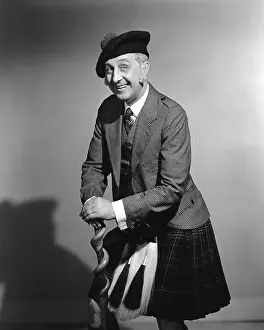 Decked: Scotsman Leaning On His Shilalee