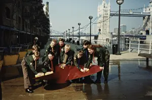 Sponge: Scouts cleaning propeller near Tower Bridge, London