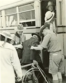 Wheelchair: Scouts helping elderly man