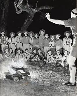 Campfire: Scouts singing round a campfire, Australia