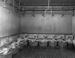 Shower: Scrubbing backs in the bath of the school, 1903