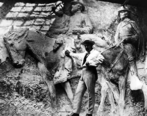 Gutzon: Sculptor Gutzon Borglum in his studio with ?