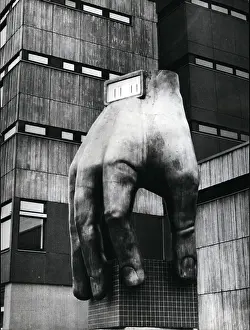 Municipality: Sculpture of hand with clock, outside school in West Berlin