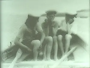 Oars: Three Sea Scouts in a dinghy off TS Mercury