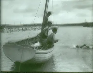 Crawl: Sea Scouts swimming off the side of a dinghy