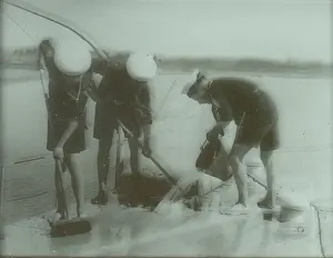 Scrubbing: Sea Scouts washing the deck