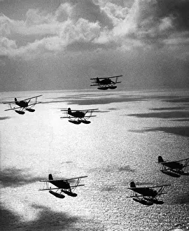 Consists: Seaplanes in chain column above the sea, 1935