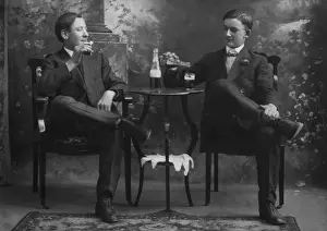 Menss: Two Seated Men Drinking Beer