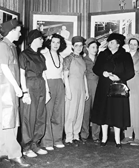 Attired: Secretary of Labor Frances Perkins examines work