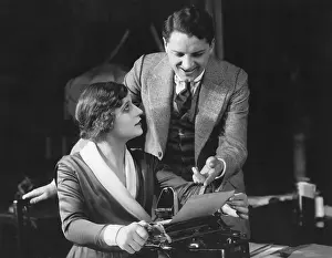 Dictating: Secretary looking at smiling manager