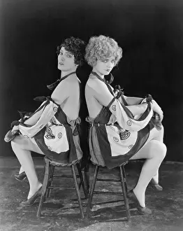 Allure: Two seductive women back to back