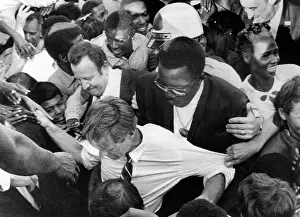 Overwhelm: Sen. Robert Kennedy tugged at from every ?