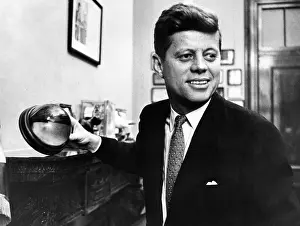 Cocoanut: Senator John F. Kennedy, holds a mounted ?