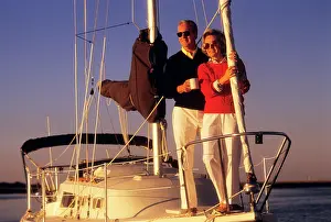 Laf002: Senior Couple Standing on Front Deck of Sail Boat