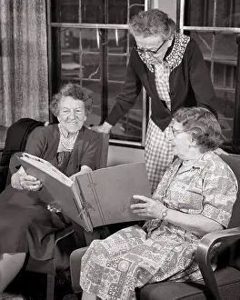 Reminiscence: Three Senior Women Standing Sitting Side by Side