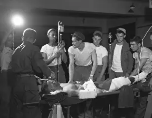Medical Care: Seriously wounded soldier prepped for surgery at