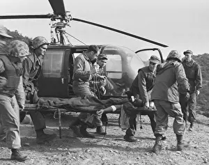 Teng: A seriously wounded U.S. Marine is rushed to helicopter