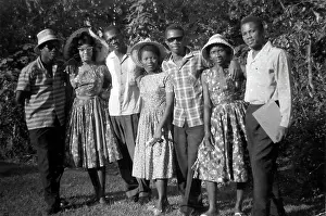 Seven black British Caribbean and African students having a