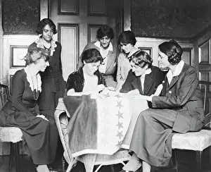 Sewing stars on suffrage flag, circa 1920