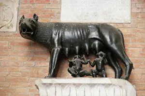 Suckle: She-wolf suckles the boys Romulus and Remus