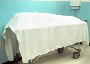 Lifeless: Sheet Draped Over Dead Body on Gurney in Morgue