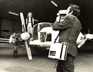 Weighs: Sheila Scott on the wing of her Piper Aztec