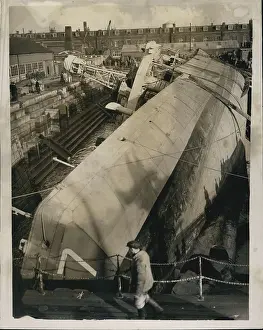 Capsized: Ship capsized by flood is refloated in dock, Sheerness