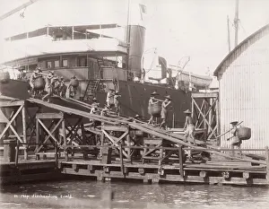 Porters: Ship discharging coal, porters, labourers, Singapore