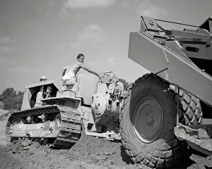 Bulldozer: Shirtless Man Worker Riding on Driving Bulldozer