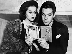 Informative: Shocked couple reading together