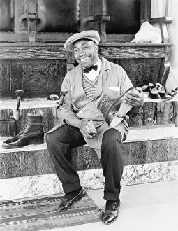 Shoeshine: Shoeshine man working and smiling