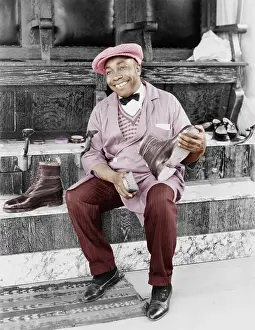 Shoeshine: Shoeshine man working and smiling