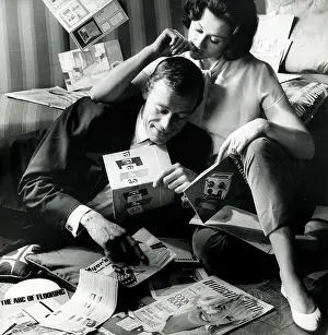 Newnes: Shoot for Woman's Own - Couple looking through magazines