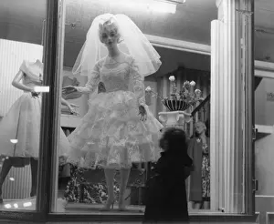 Robin Adler: Shop window display with wedding dress