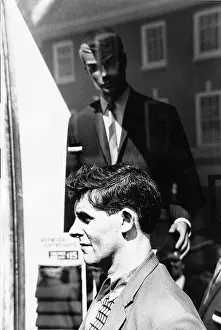 Krish: Shop window dummy looking at man in street