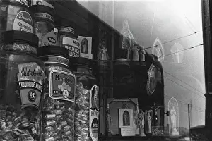 Wiring: Shop window with sweet jars and religious statues